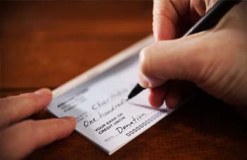 Photo of person writing a cheque